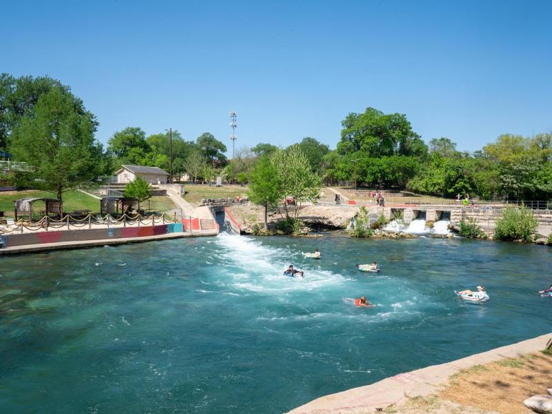 a group of people swimming in a body of water