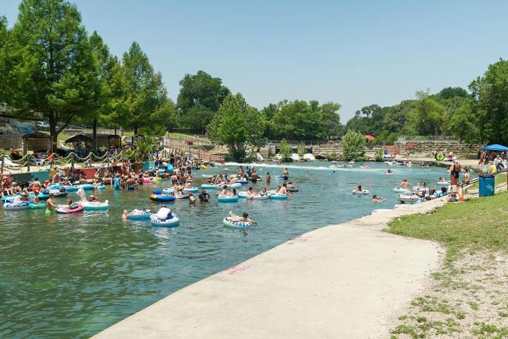 a group of people in a pool of water